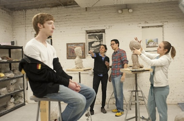 Plastic surgeons sculpt a bust with the help of sculptor Morgan Yacoe.